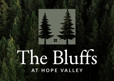 Logo design for The Bluffs at Hope Valley - pine tree logo, negative space logo, village logo, forest logo, nature logo, rustic logo design, cabin logo, woodland branding, scenic village logo, nature-inspired logo, tree silhouette logo